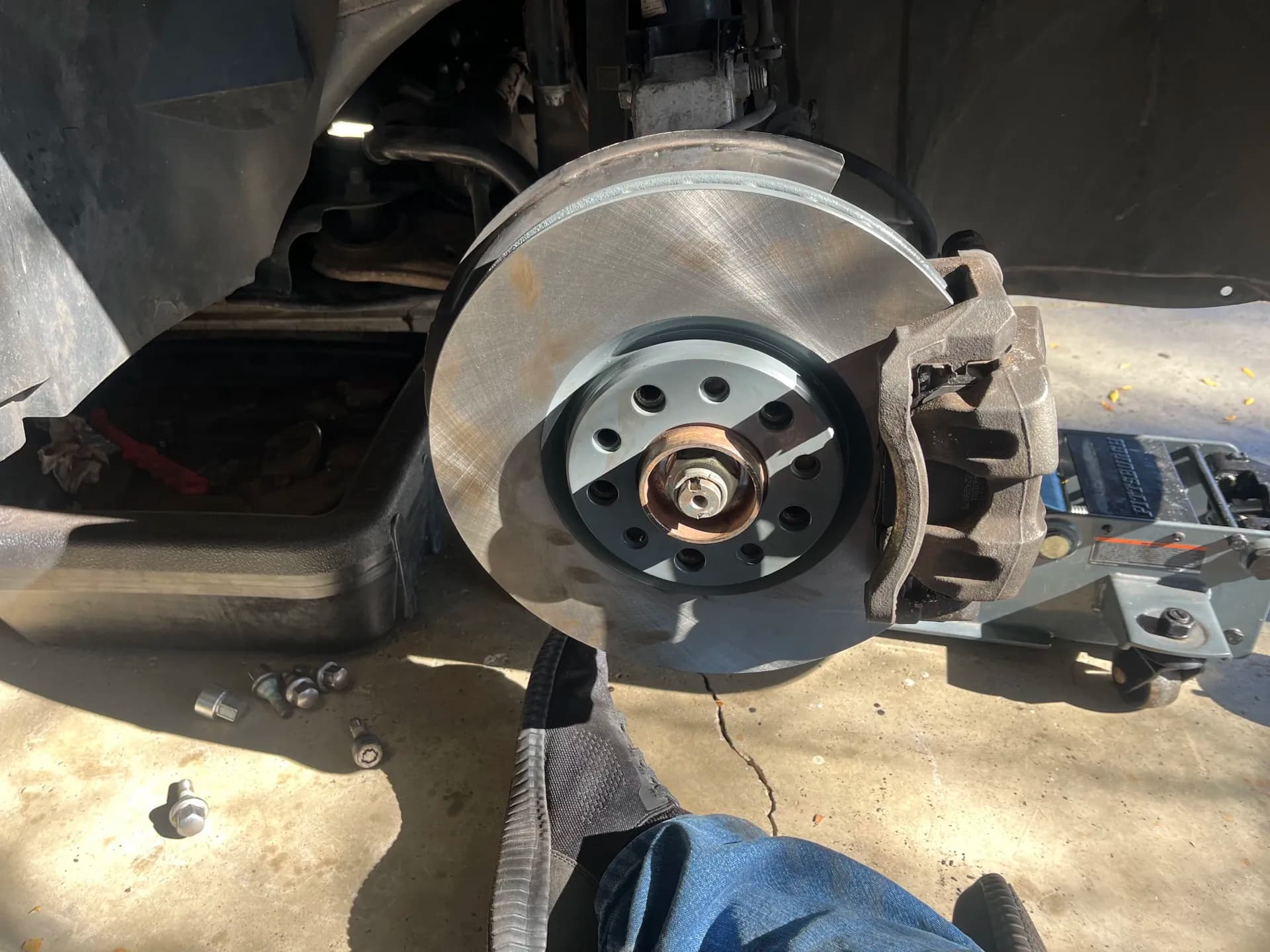 Completed mobile brake service with rotor and caliper reassembled