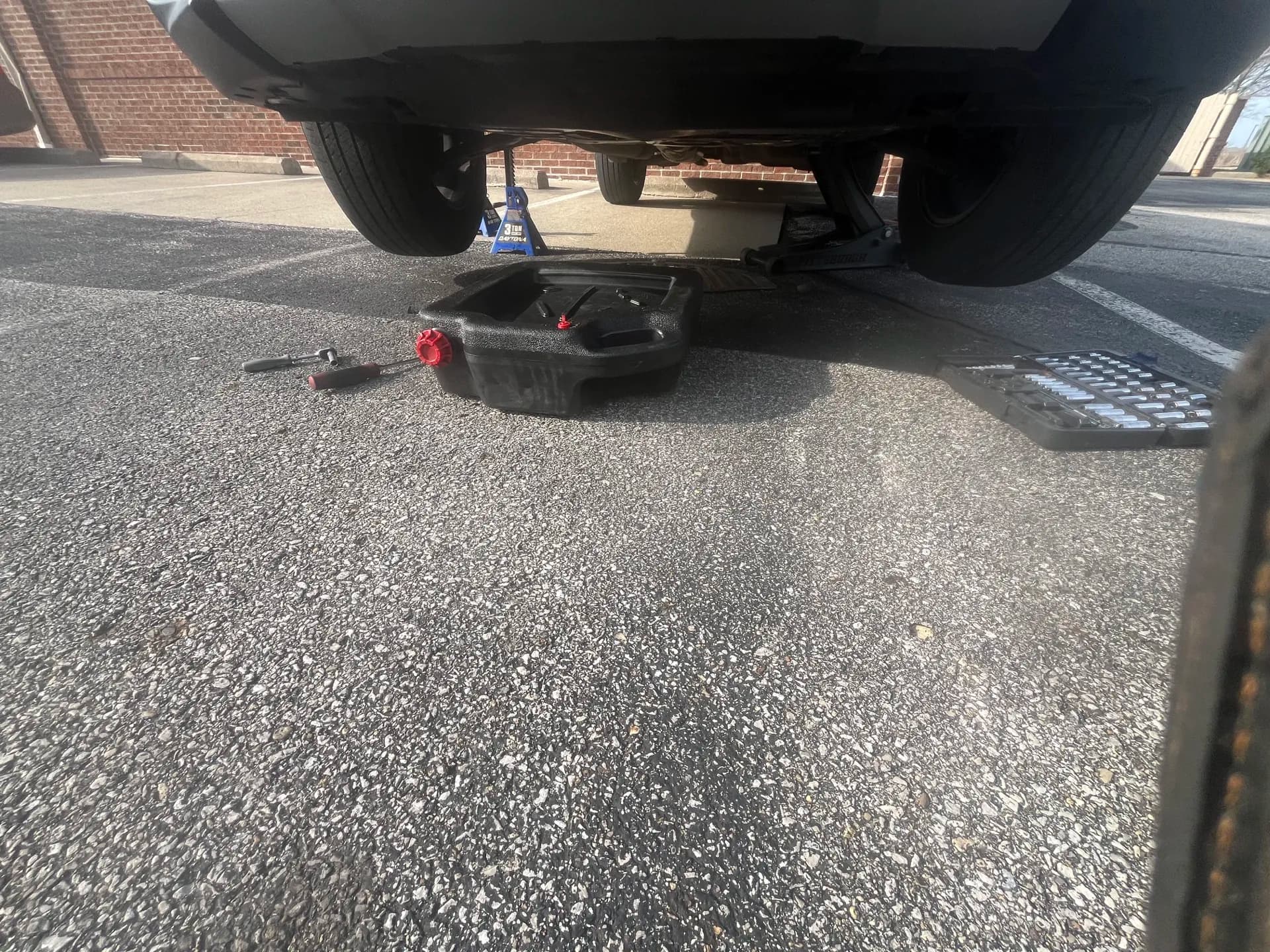 Mobile oil service performed beneath a safely supported vehicle near Westerville, Ohio