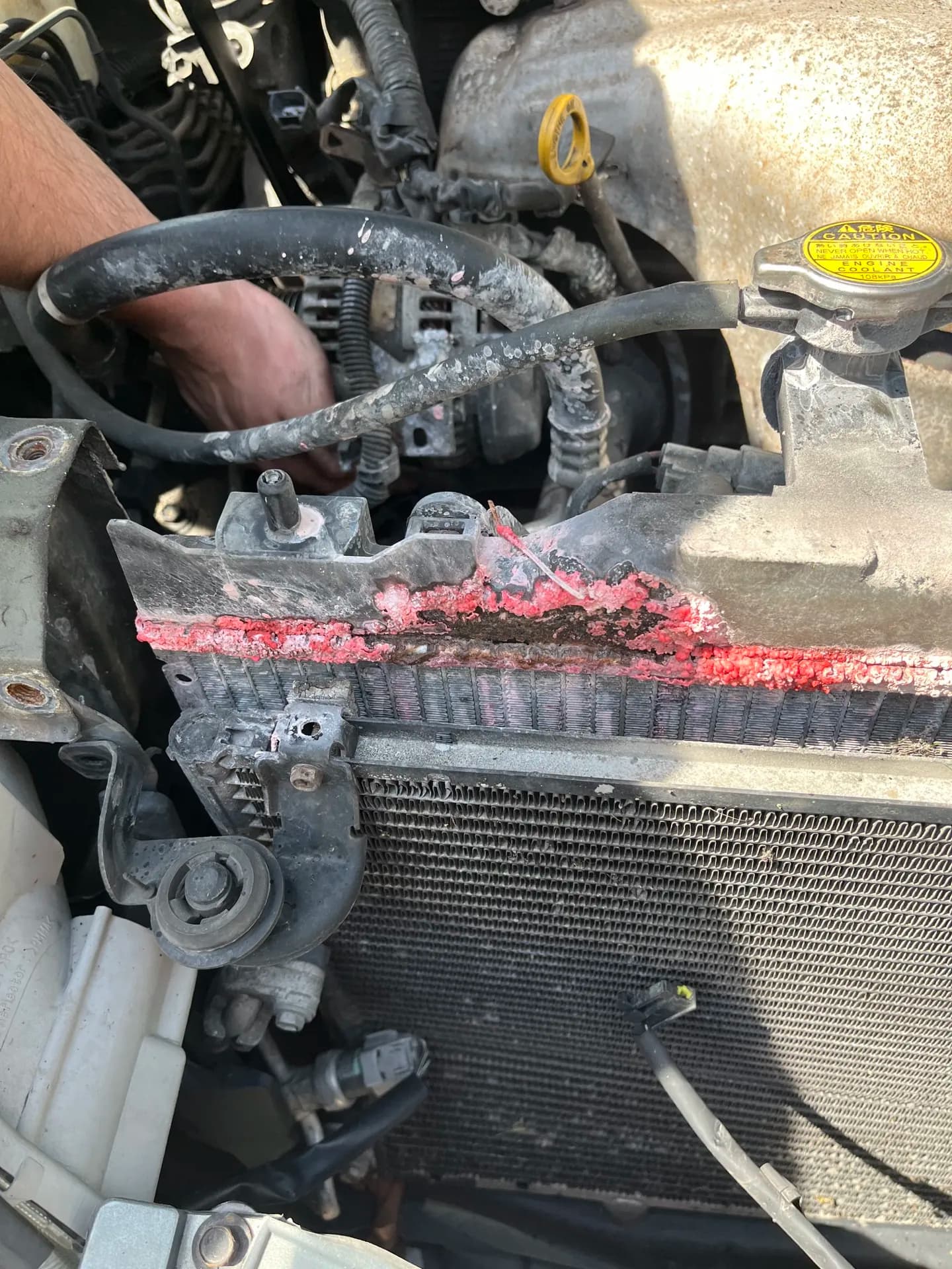 Radiator area exposed during a mobile coolant leak repair