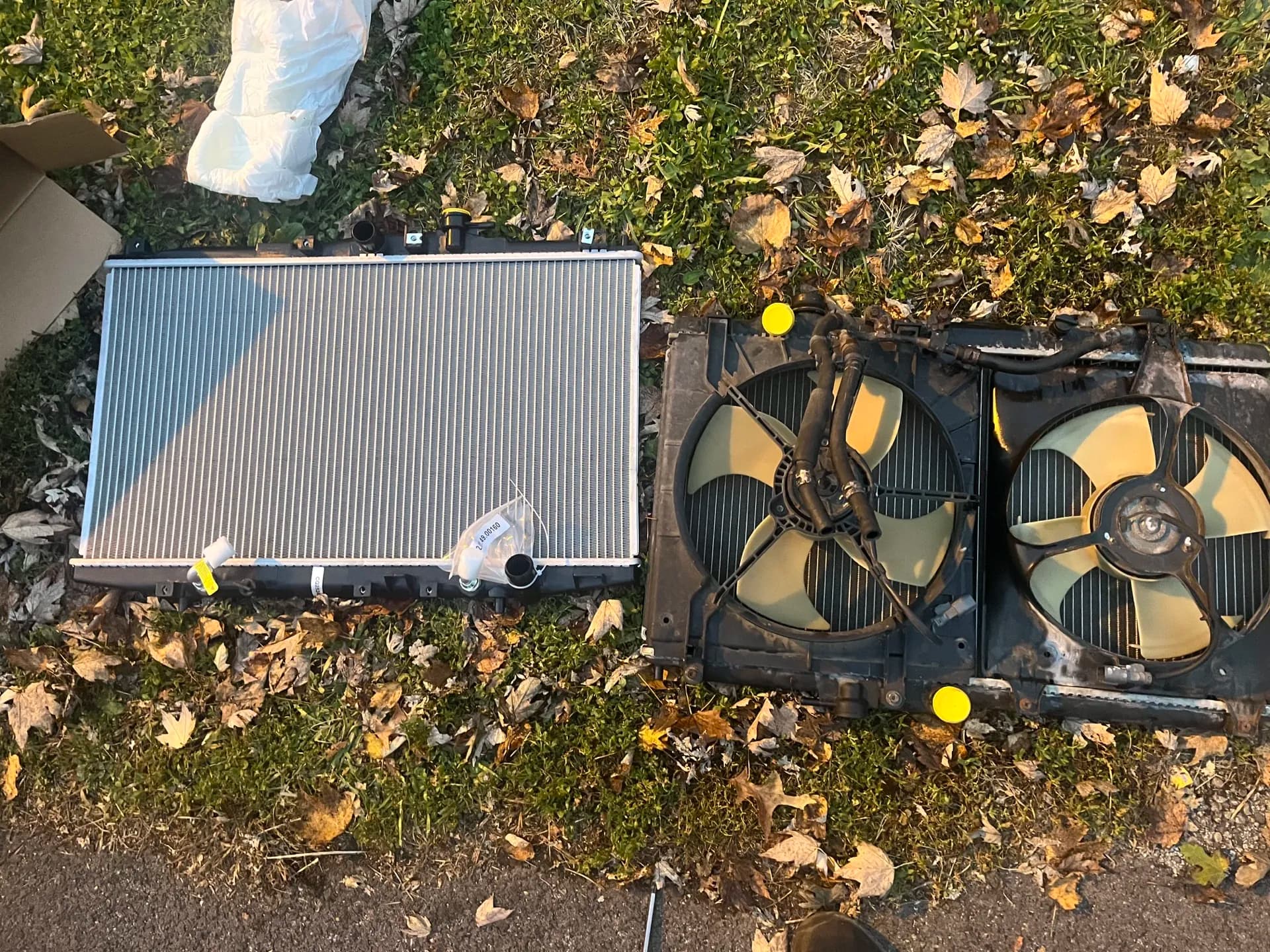 Replacement radiator and cooling fans prepared for a mobile overheating repair
