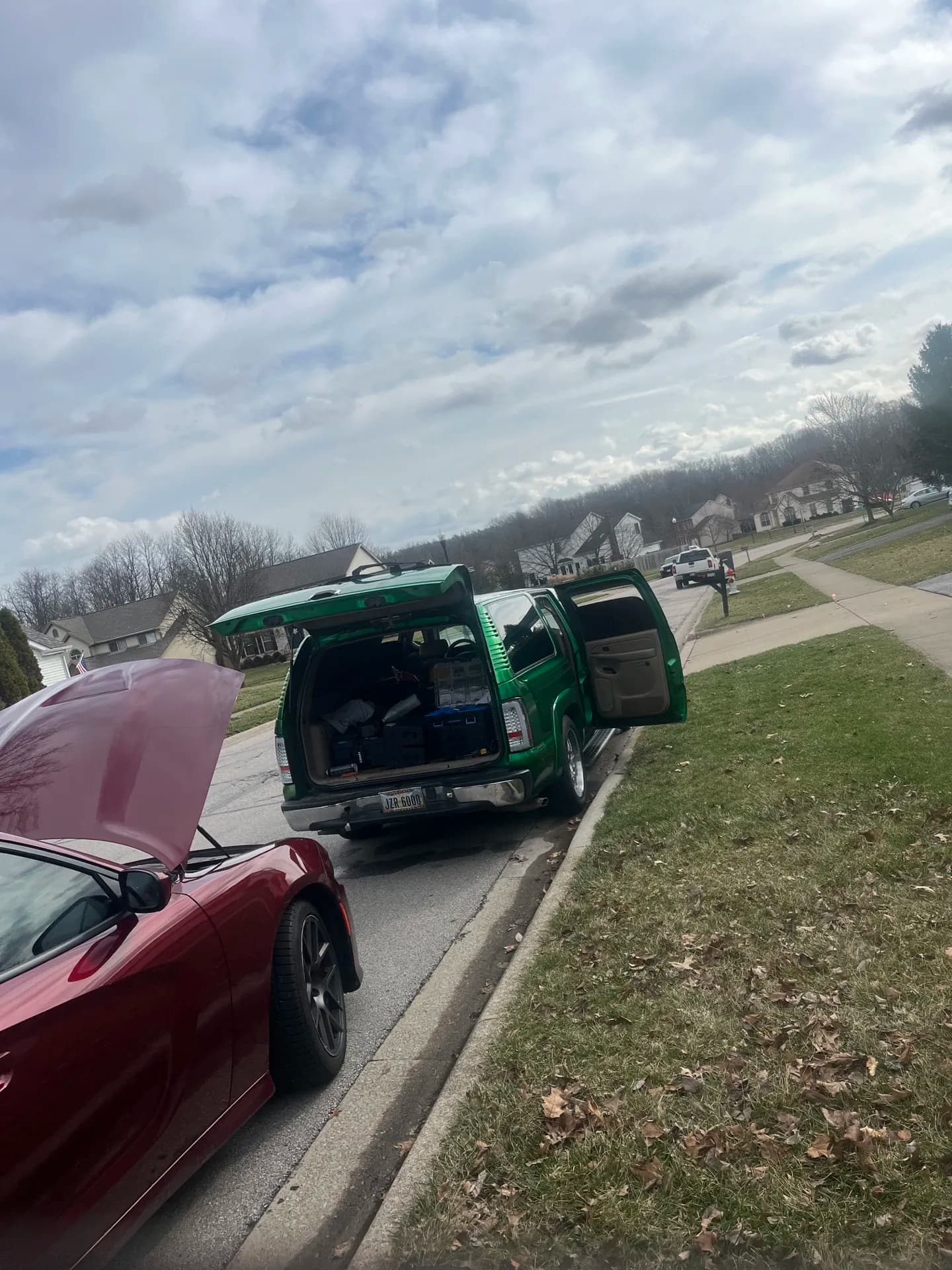 Wayne's mobile service truck parked behind a customer's vehicle on location