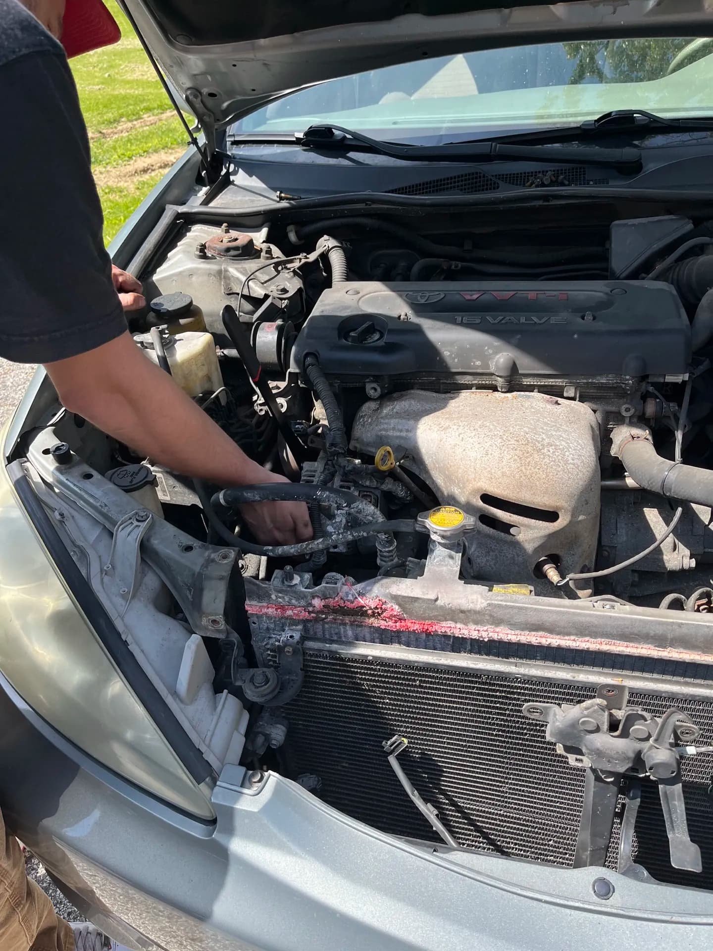 Hands-on cooling-system repair in progress at a customer's location