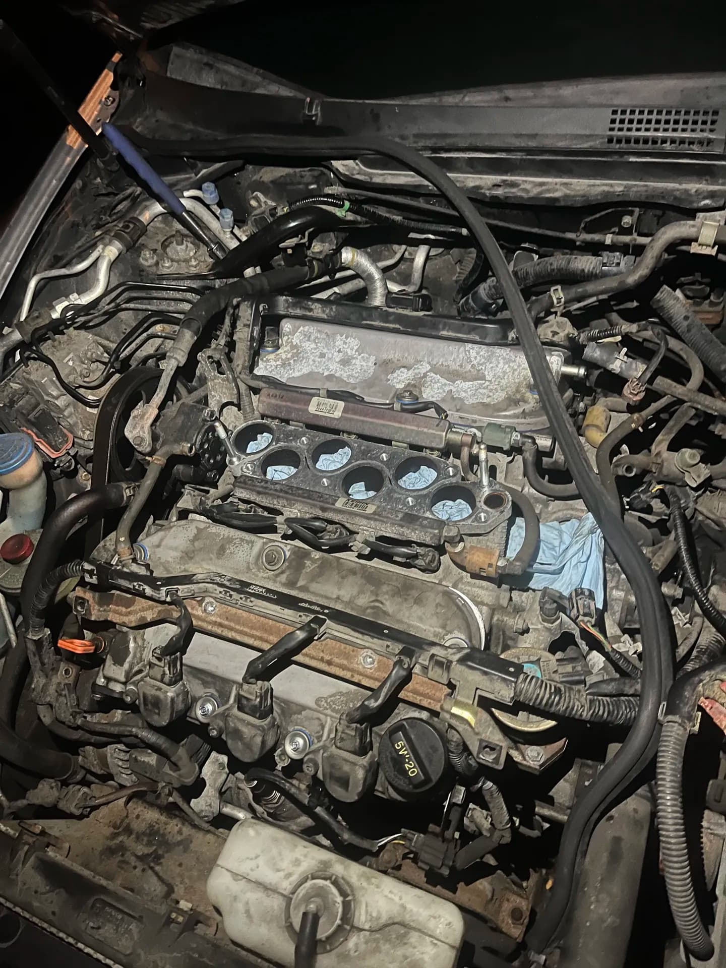 Engine tune-up in progress with ignition components accessible for service